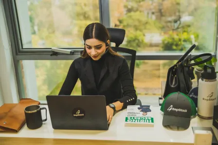 RepStack associate working at desk with laptop.
